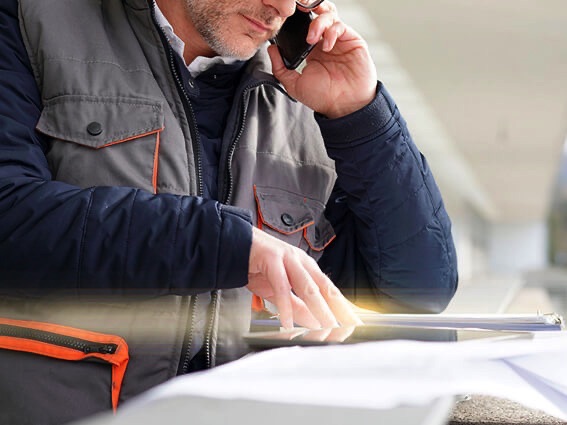 Contact page image of man on a cell phone